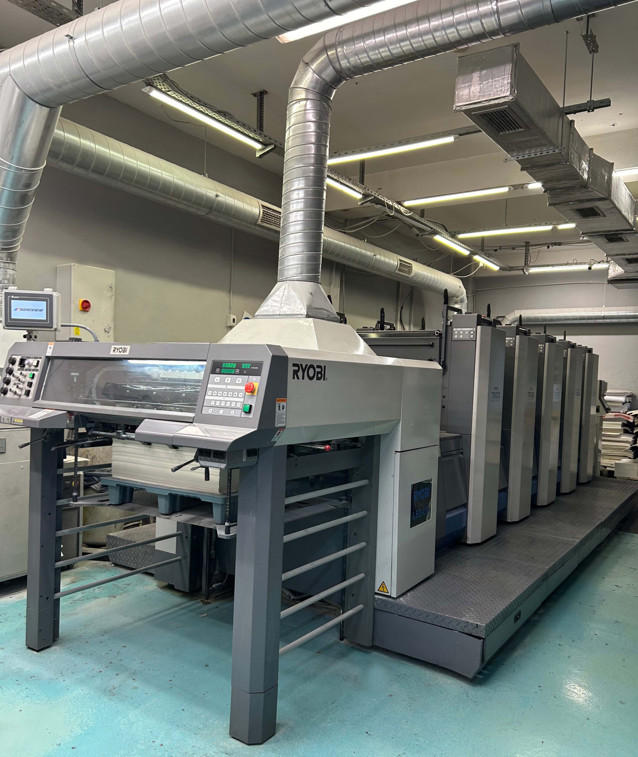 Advanced machinery used in luxury paper bag manufacturing at our facility